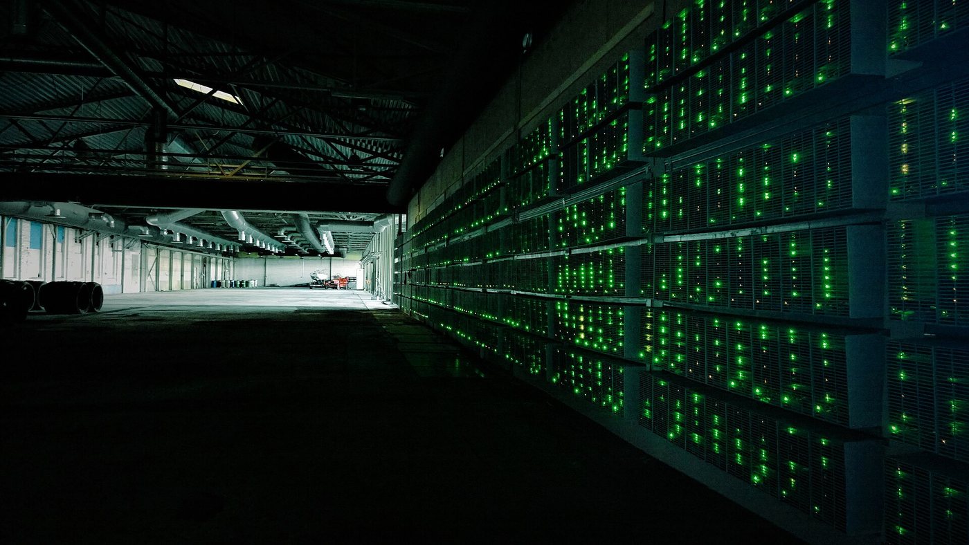 Bitcoin mining facility with racks of ASIC miners