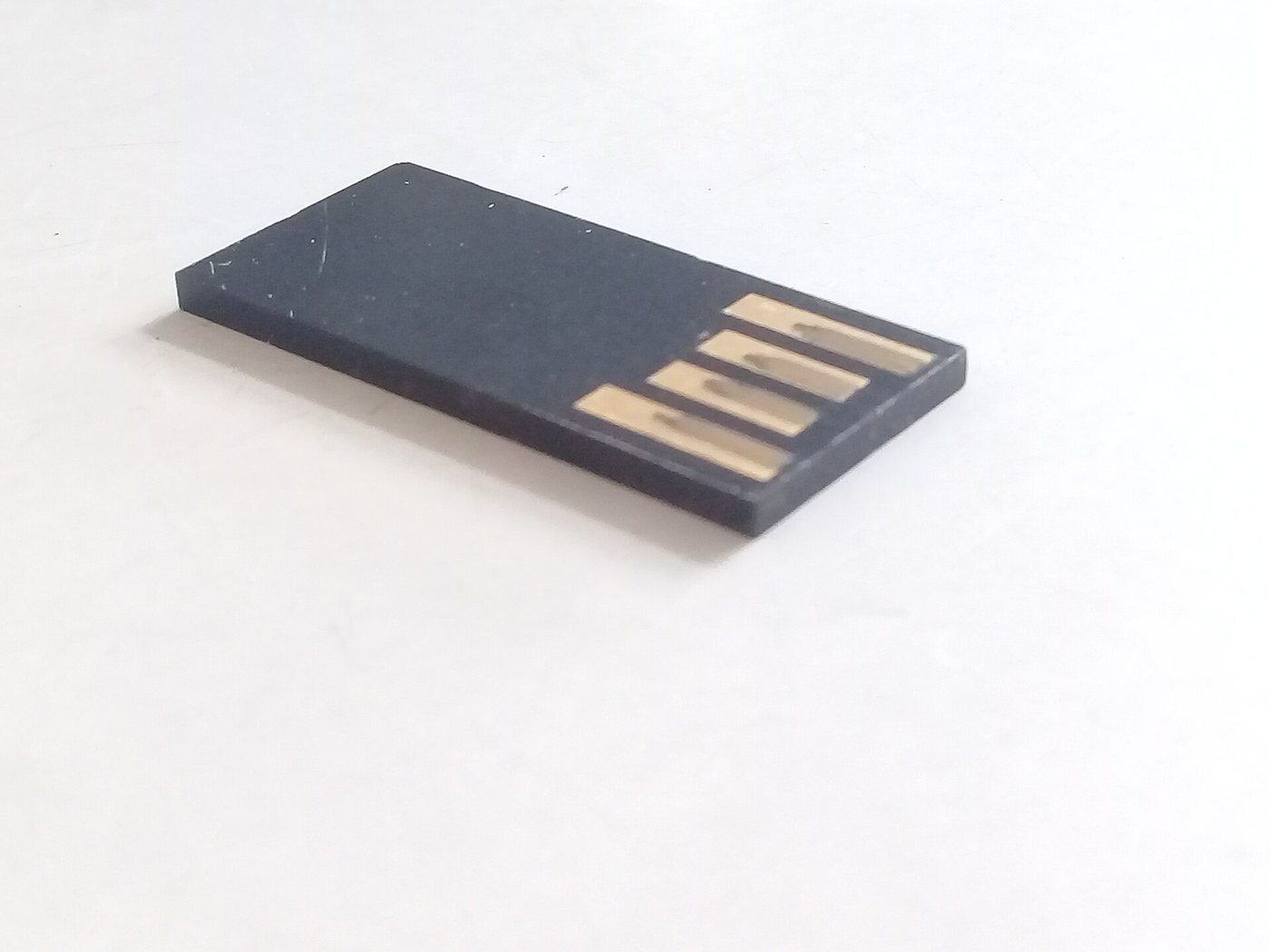 A NAND flash chip on a USB drive board